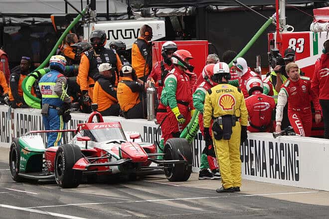 Robert Shwartzman, driver of the #83 PREMA Racing Chevrolet, runs into his crew as he pits during the NTT IndyCar Series109th running of the Indianapolis 500 at Indianapolis Motor Speedway on May 25, 2025. Photo by James Gilbert/Getty Images.