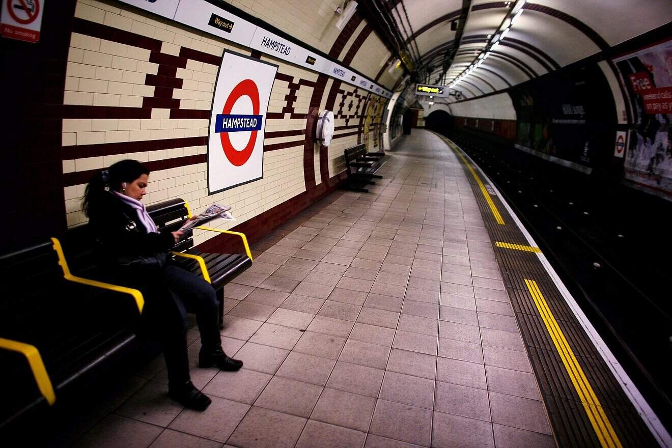A passengers waits for the tube at Hampstead Underground Station, Jan. 16, 2007. Photo by Daniel Berehulak/Getty Images.