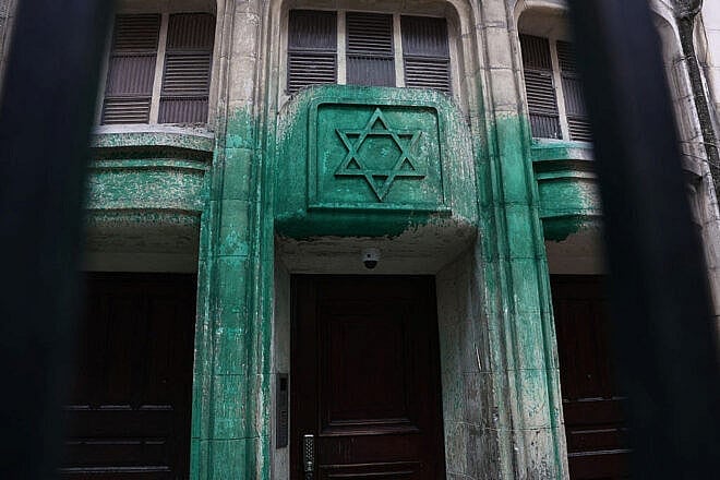 Green paint spray-painted by vandals is seen on the walls of the Agoudas Hakehilos synagogue in Paris on May 31, 2025. Photo by Thibaud Moritz/AFP via Getty Images.