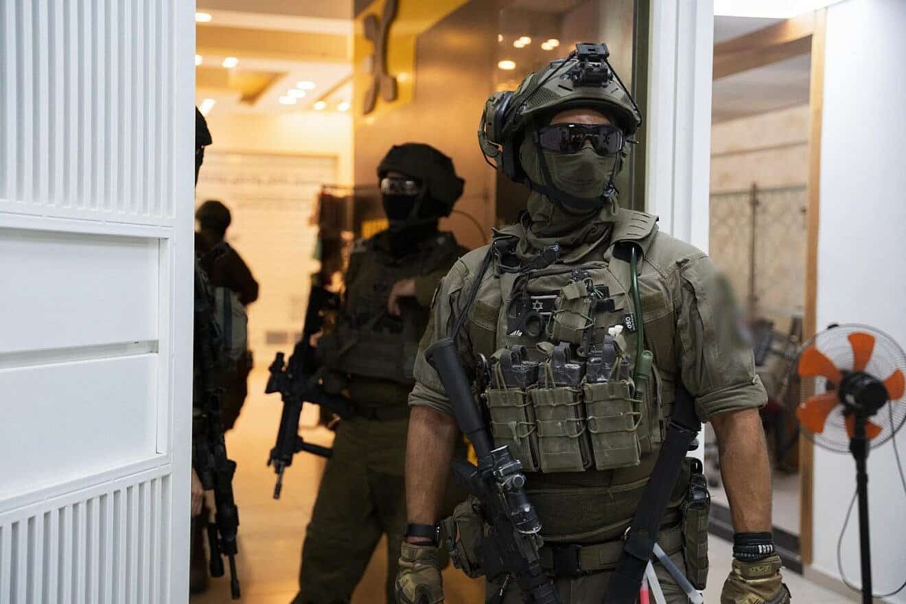Israeli security forces conduct a raid on a currency exchange business in Judea and Samaria. Credit: IDF.