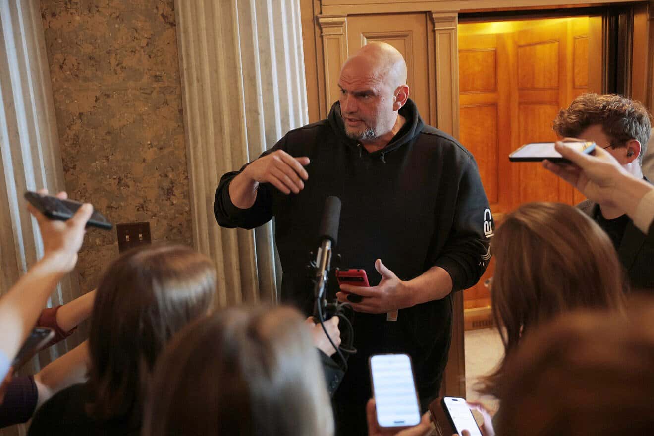 Sen. John Fetterman (D-Pa.) speaks to reporters outside of the Senate Chambers at the U.S. Capitol in Washington, D.C., on March 13, 2025. 
 Photo by Anna Moneymaker/Getty Images.