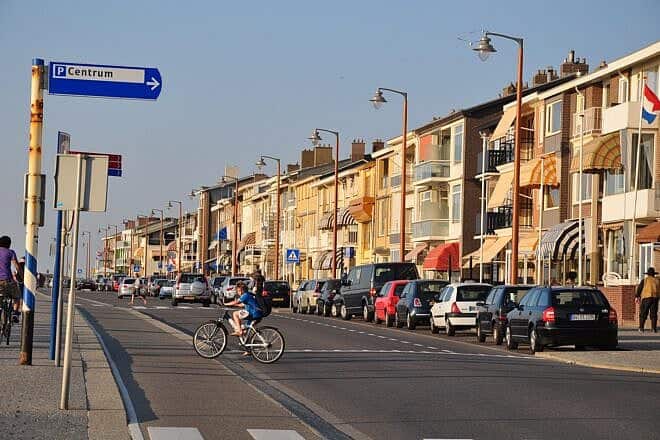 A boy cycles in the coastal town of Katwijk in the Netherlands on April 25, 2011. Credit: Vincent van Zeijst via Wikimedia Commons.