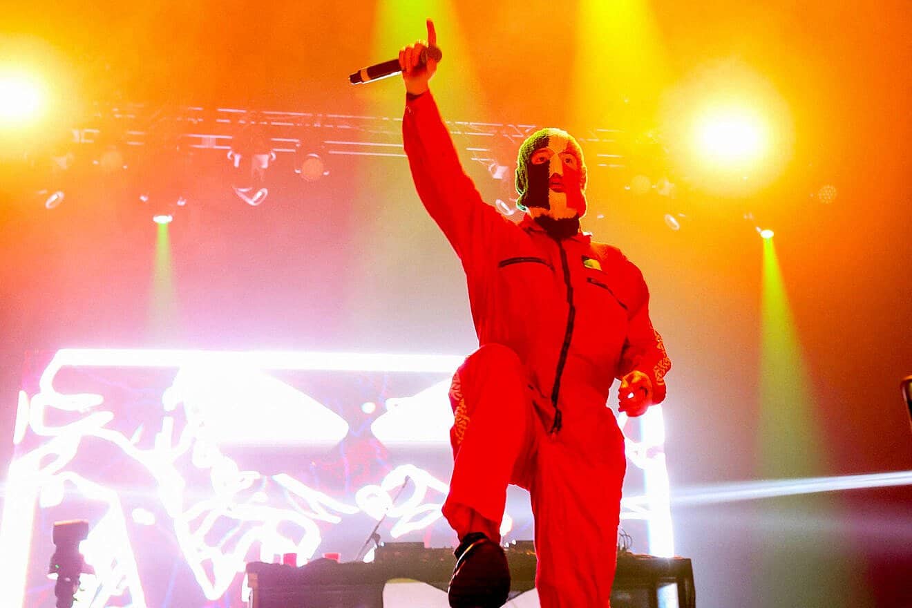 DJ Provai from Irish hip-hop trio Kneecap performs onstage during the 2025 Coachella Valley Music and Arts Festival at Empire Polo Club in Indio, Calif., on April 11, 2025. Photo by Valerie Macon/AFP via Getty Images.
