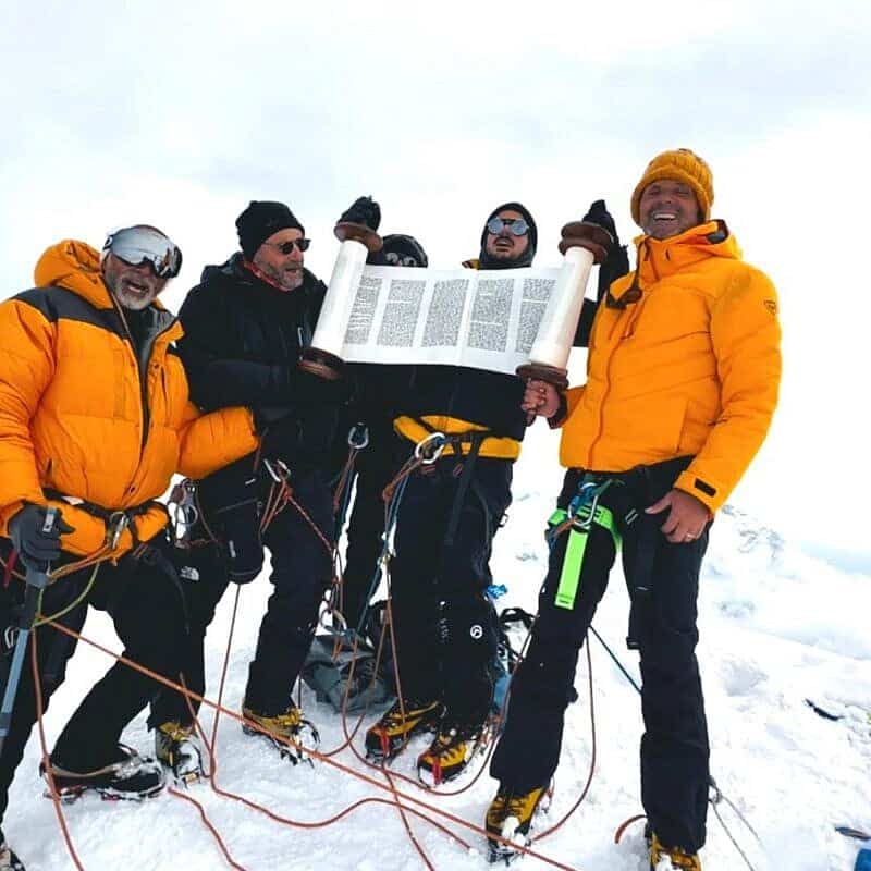 Minyan Everest climbers with their Torah scroll atop Mera Peak in northeastern Nepal, May 6, 2025. Credit: Minyan Everest.