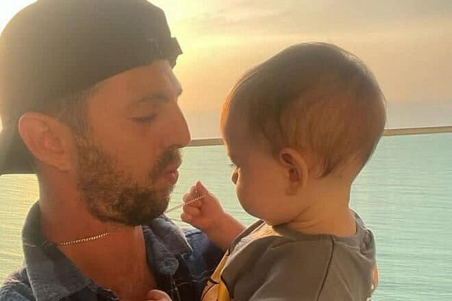 Elkana Bohbot with his baby son, Re'em. Bohbot was taken captive on Oct. 7, 2023, and has spent more than 580 days in captivity in the Gaza Strip. Credit: Courtesy of the Bohbot family.