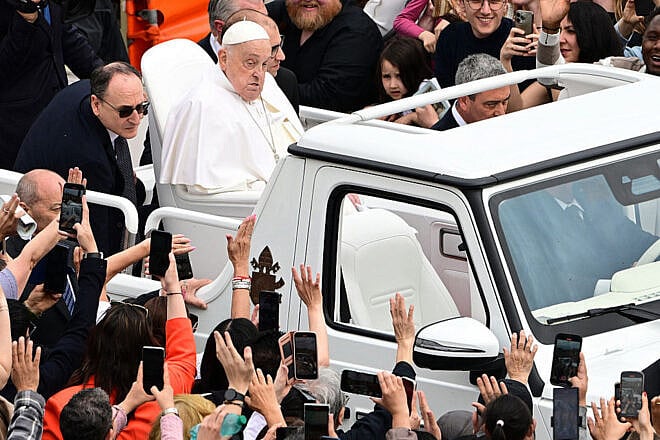 Pope Francis waves to the crowd from a popemobile after Easter mass at St. Peter's Square in the Vatican, on April 20, 2025. Photo by Tiziana Fabi/AFP via Getty Images.
