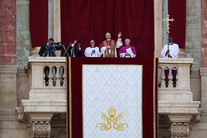 Pope Leo XIV waving from the loggia of St. Peter's Basilica in Rome in his first public appearance. Credit: Edgar Beltrán/The Pillar via Wikimedia Commons.