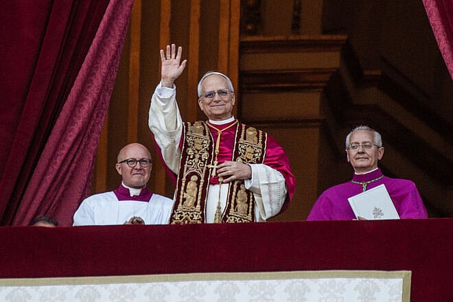 Pope Leo XIV greets the crowd from St. Peter's Basilica in Vatican City after being elected by the Conclave of Cardinals on May 8, 2025. Photo by Ivan Romano/Getty Images.