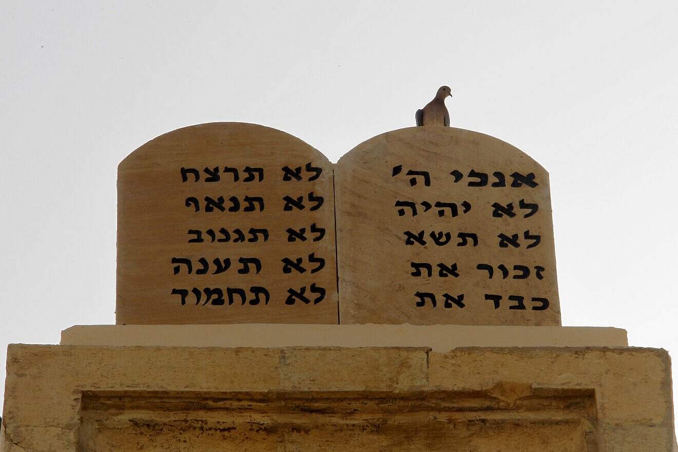 A pigeon perches on stone tablets bearing the Ten Commandments in Hebrew on top of the Magen Abraham Synagogue in downtown Beirut on Oct. 19, 2010. A few hundred Jews live in Lebanon, compared to 24,000 in 1948. Photo credit should read JOSEPH EID/AFP via Getty Images.