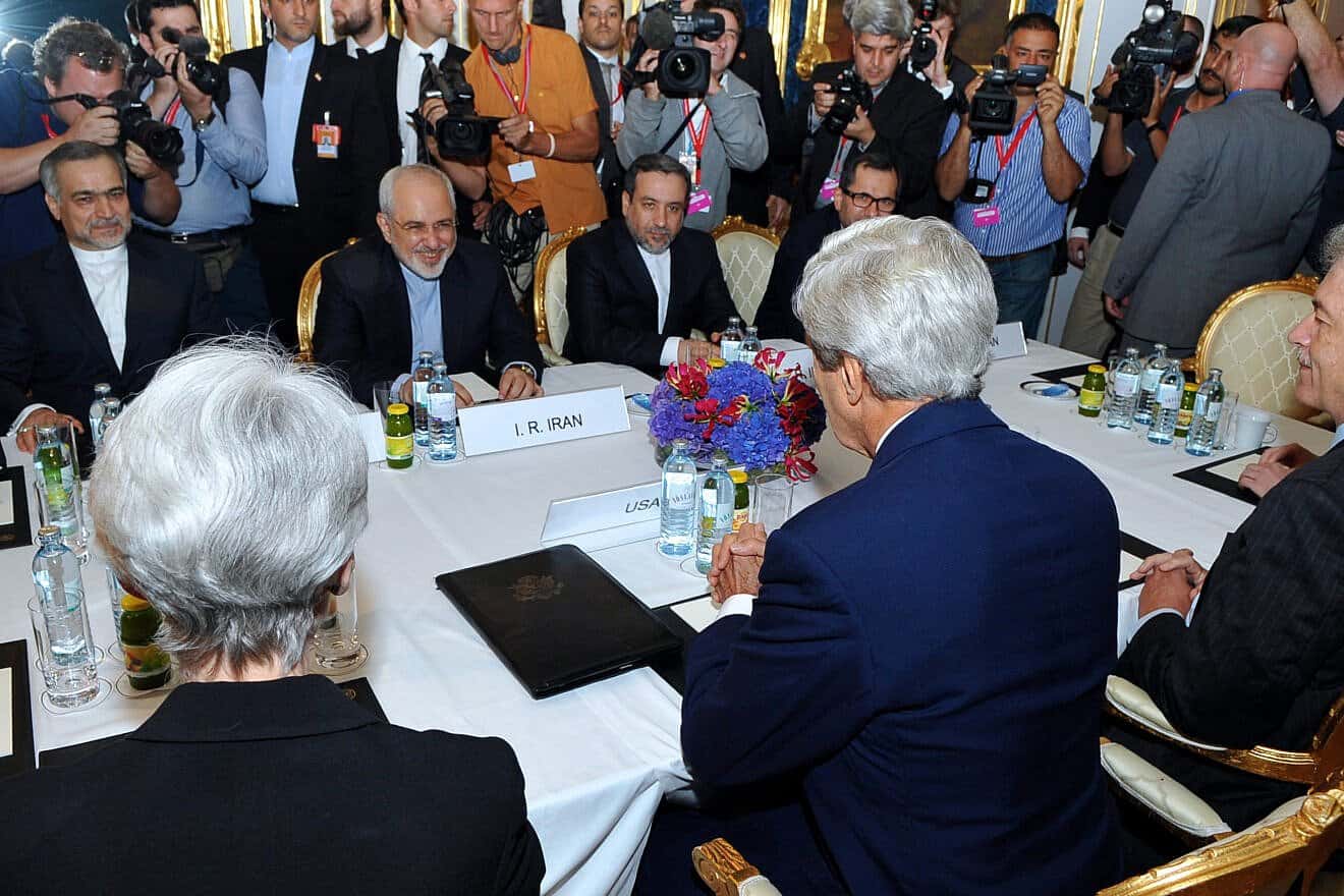 U.S. Secretary of State John Kerry sits across from Iranian Foreign Minister Mohammad Javad Zarif in Vienna, Austria, before they begin a bilateral meeting focused on Iran's nuclear program and a year before a deal is signed, July 13, 2014. Credit: U.S. State Department Photo/ Public Domain via Wikimedia Commons.
