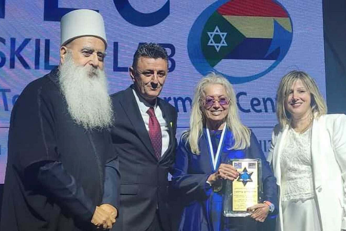 Dr. Miriam Adelson, standing between Koftan and Salha Halabi, receives the Druze Community Honorary Award from spiritual leader Sheikh Mowafaq Tarif at the launch of the Druze Hi-Tech Empowerment Center in Usfiya, near Haifa, on May 5, 2025. Credit: Druze Veterans Association for the Advancement of the Israeli-Druze Soldier.