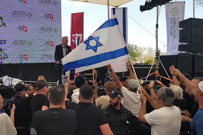 Protesters chant "traitor" as Yair Golan speaks at a conference in Be'er Sheva, Israel on may 27, 025. Photo by Canaan Lidor.