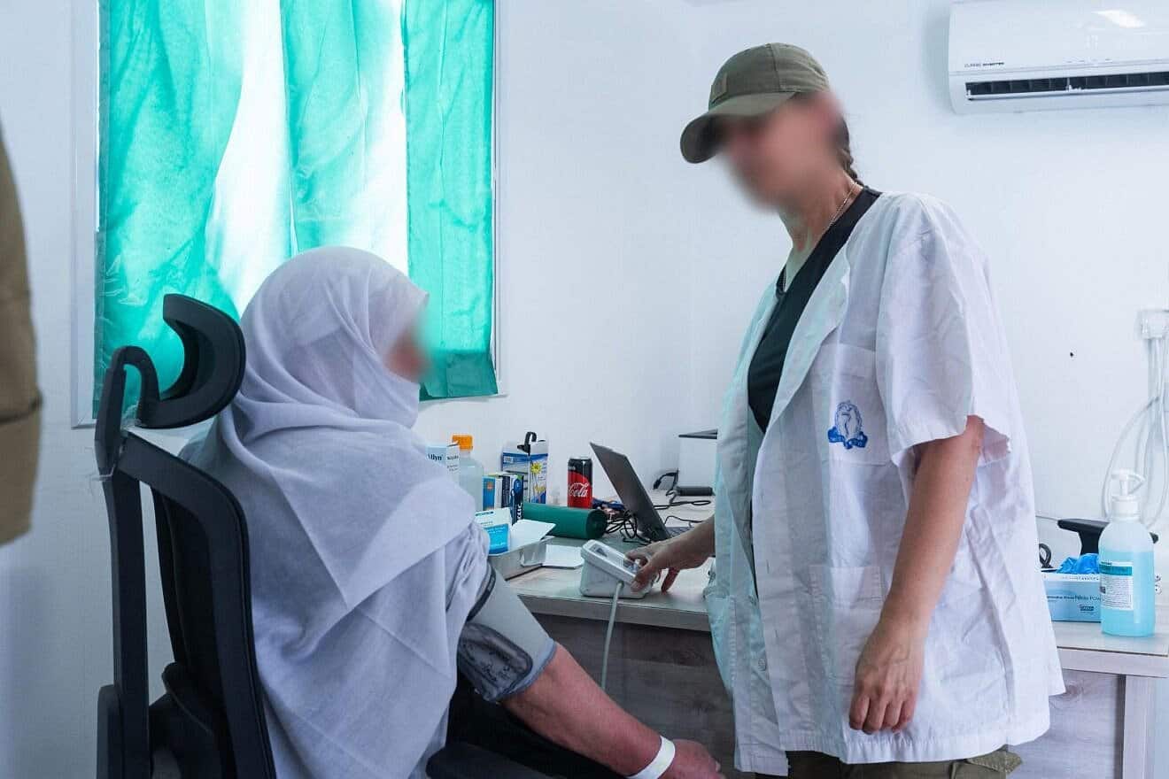 An Israeli medic treats a civilian at an Israel Defense Forces facility in southern Syria, May 2025. Credit: IDF.