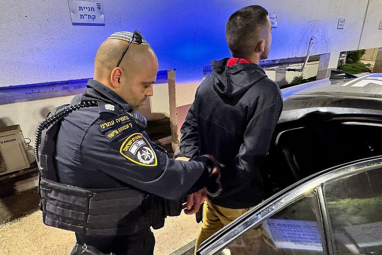 The suspect is arrested and taken into custody by security forces, May 18, 2025. Credit: Israel Police.
