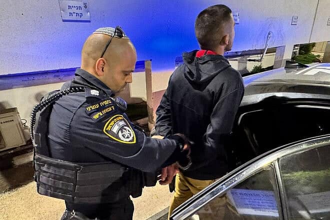 The suspect is arrested and taken into custody by security forces, May 18, 2025. Credit: Israel Police.