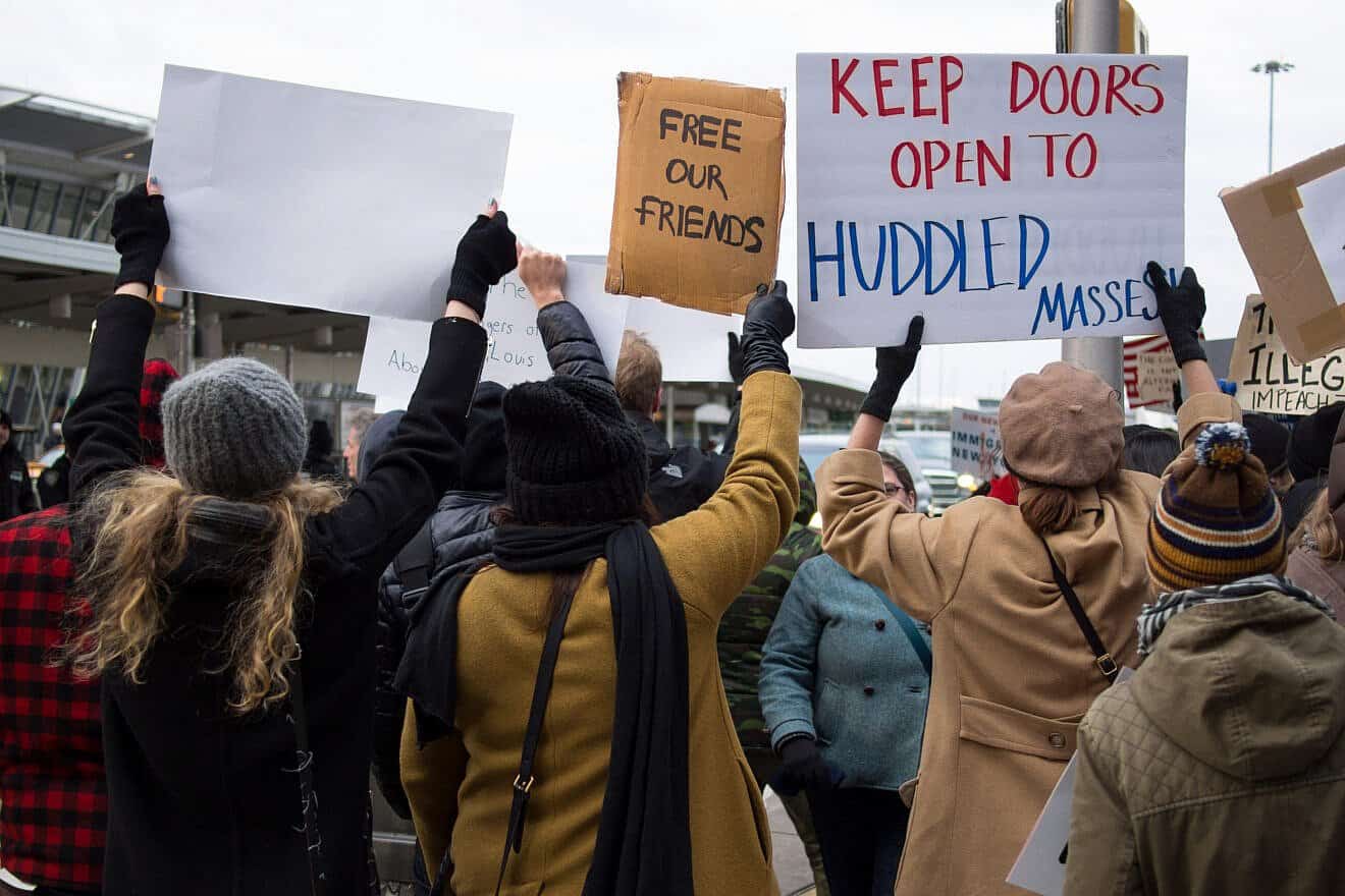 Demonstrators outside John F. Kennedy International Airport in New York City to protest President Donald Trump's travel ban during his first term in office, on Jan. 28, 2017. Credit: Rhododendrites via Wikimedia Commons.
