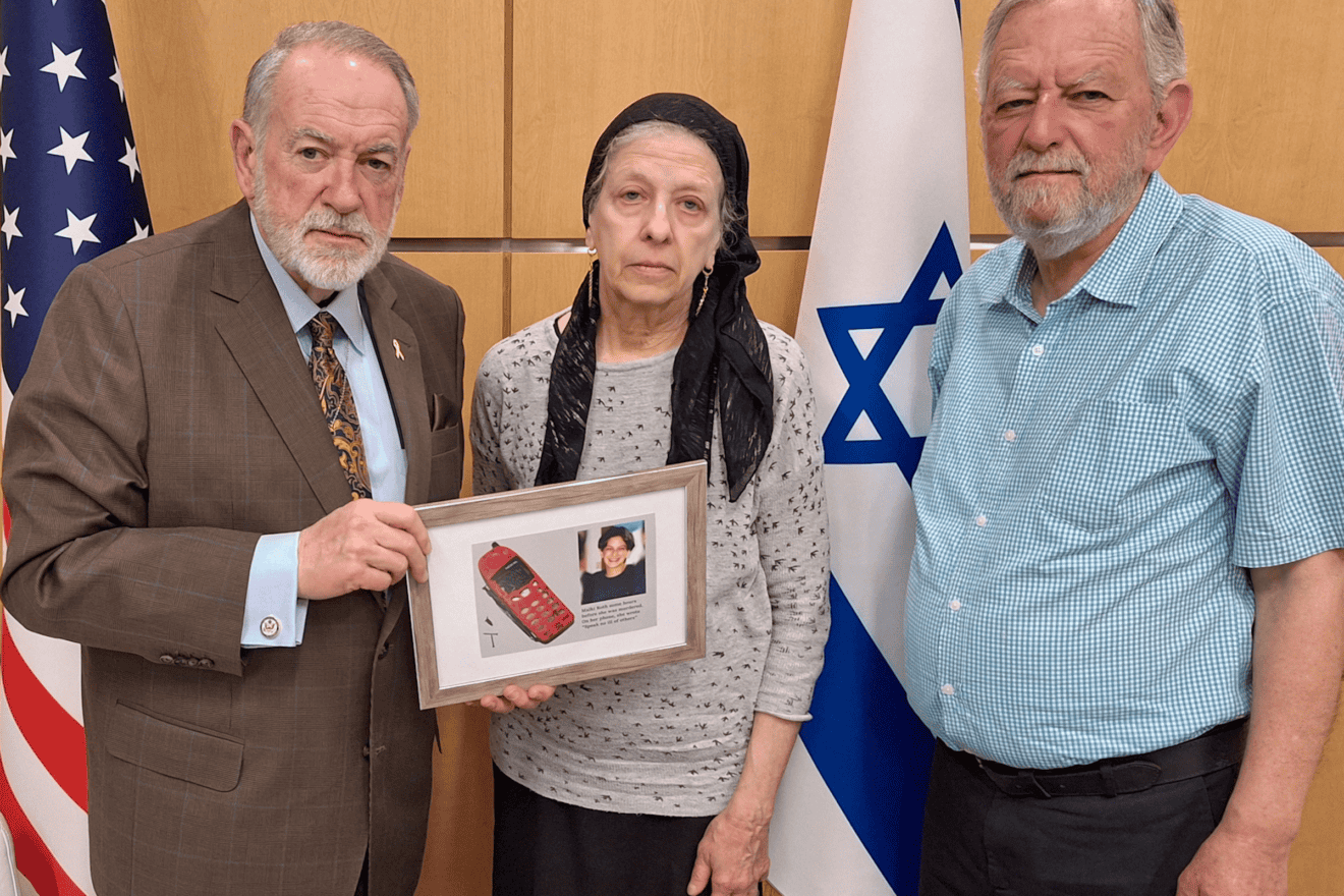 U.S. Ambassador to Israel Mike Huckabee meets with Frimet and Arnold Roth, whose daughter Malki was murdered in a 2001 bombing. Credit: Courtesy of the Roth family.
