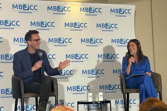 Deedee Bitran, senior counsel and director of the pro bono network at the Saidoff Legal Department at StandWithUs, and Shai Davidai, an aqssistant professor of business at Columbia University, speak at an event in Miami Beach, Fla., on May 5, 2025. Credit: Courtesy of Deedee Bitran.