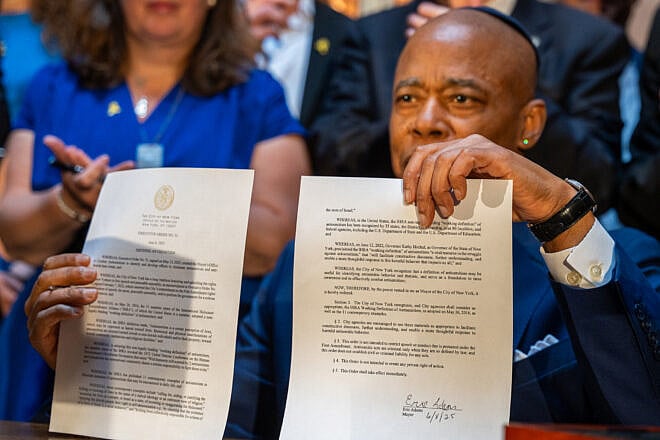New York City Mayor Eric Adams signs an executive order and proposes legislation to codify into law the International Holocaust Remembrance Alliance definition of antisemitism, Tribeca Synagogue, New York, N.Y., June 8, 2025. Credit: Benny Polatseck/Mayoral Photography Office.