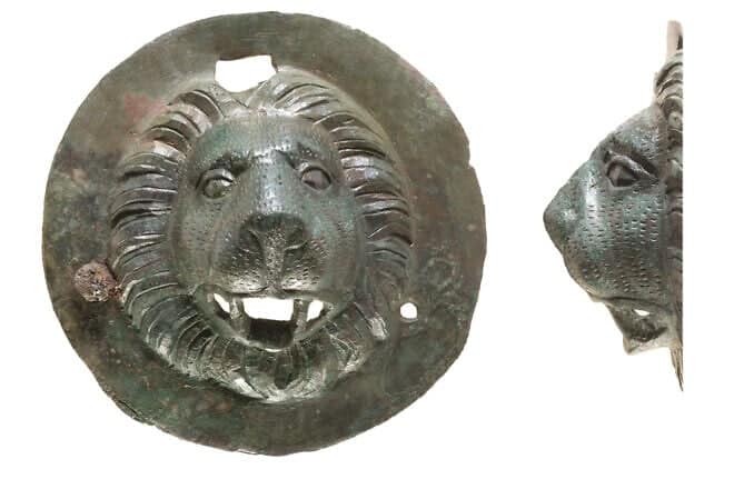 One of the bronze lion-head discs. Credit: Dafna Gazit, Israel Antiquities Authority.