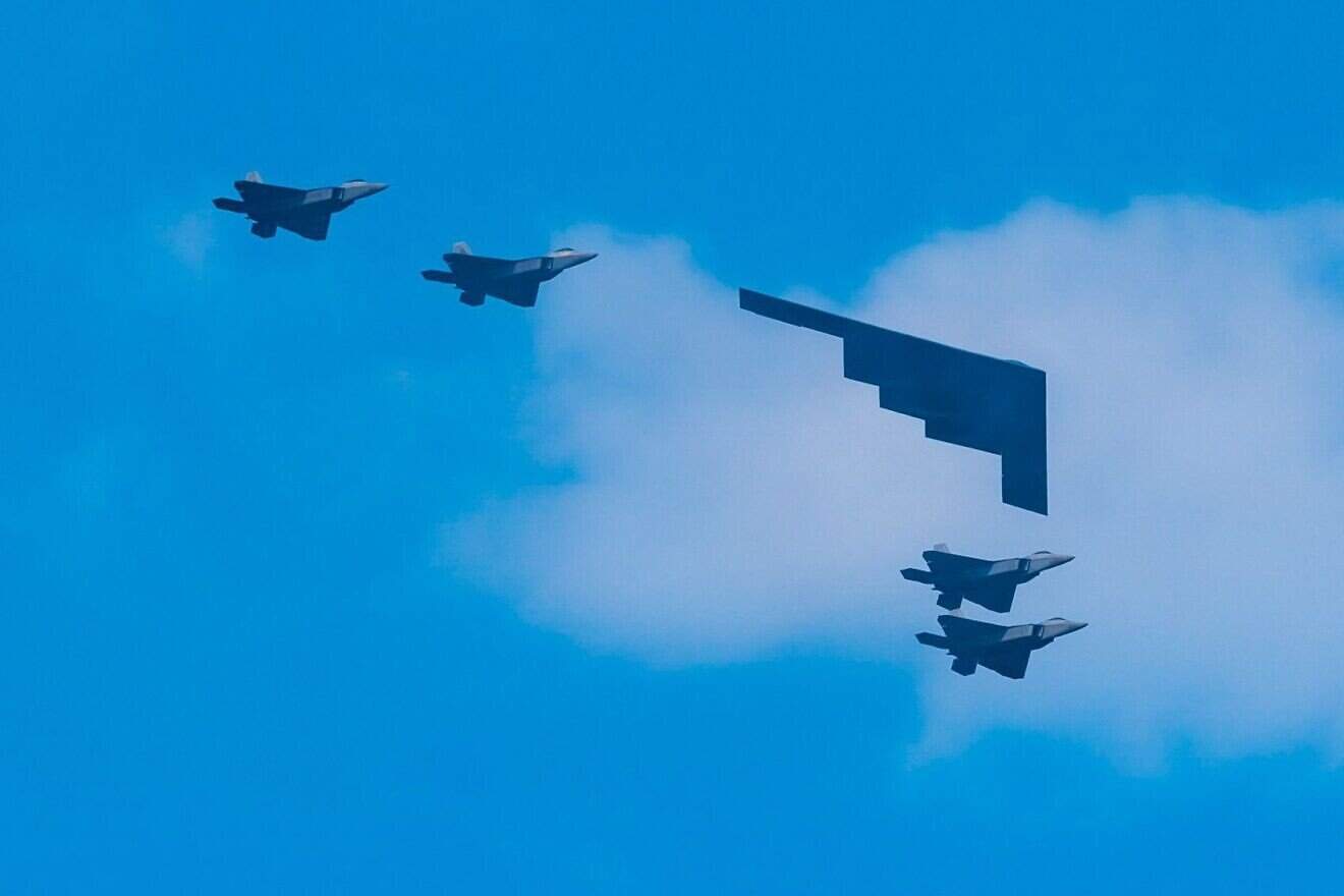 A B-2 Spirit Stealth Bomber and F-22 fighter jets during the Independence Day military flyover in Lower Manhattan, on July 04, 2020. Photo by Gotham/Getty Images.