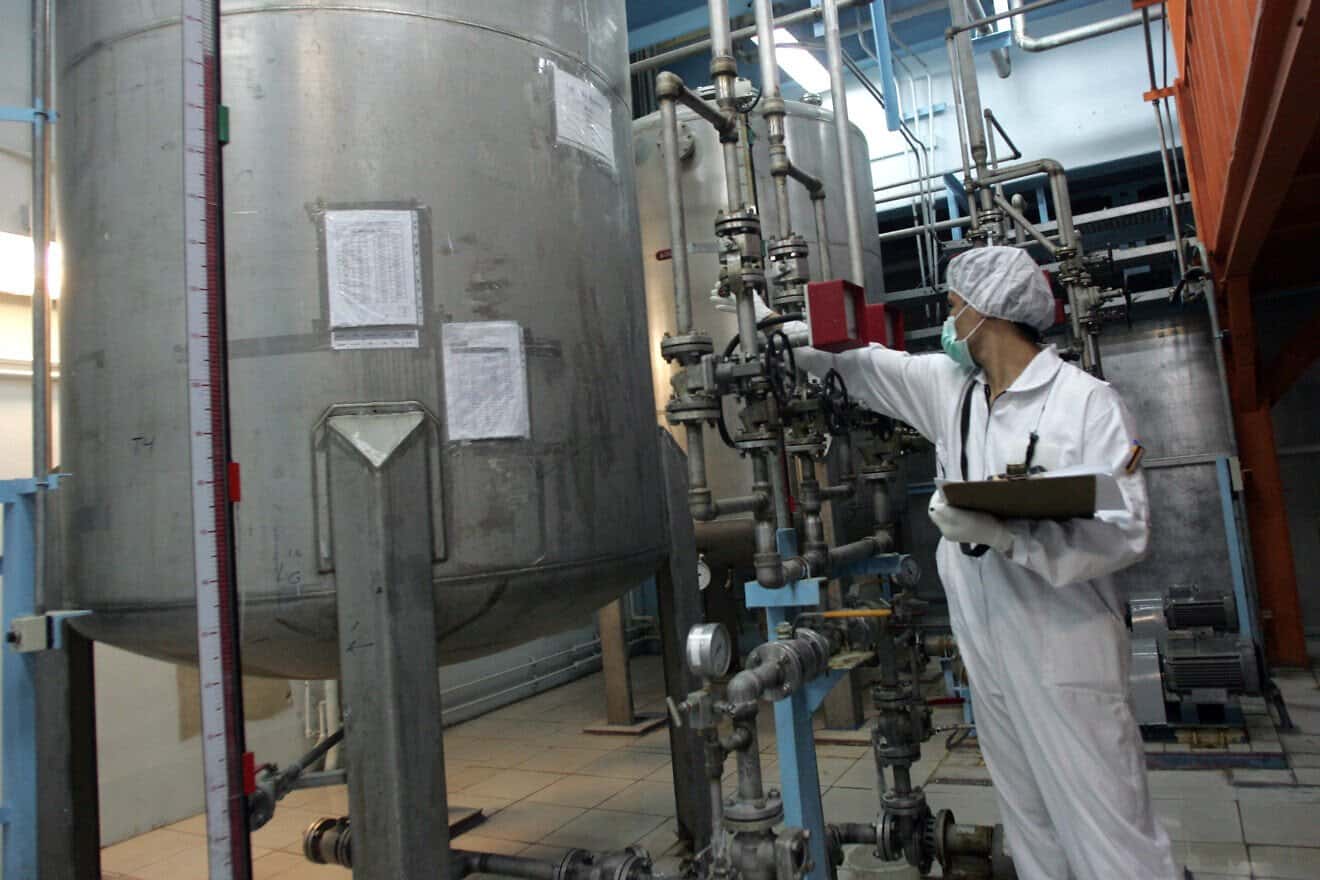 A technician works at the Isfahan Uranium Conversion Facility (UCF), since renamed the Isfahan Nuclear Technology Center, 260 miles south of Tehran, Feb. 3, 2007. Photo by Behrouz Mehri/AFP via Getty Images.