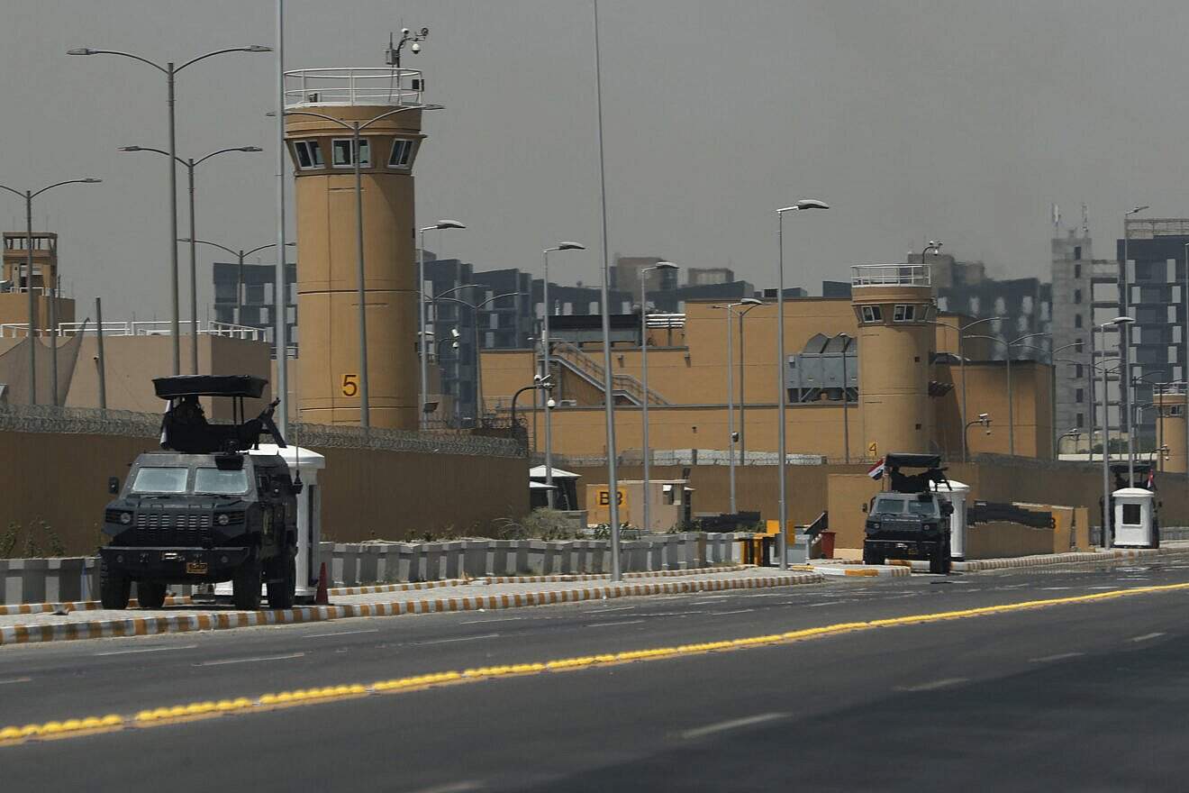 Armored vehicles of the Iraqi Counter Terrorism Forces are deployed outside the U.S. embassy building in Baghdad's Green Zone after an announcement by a U.S. official the previous day that staff levels at the diplomatic mission in Iraq were being reduced over security concerns, on June 12, 2025. Photo by Ahmad Al-Rubaye/AFP via Getty Images.