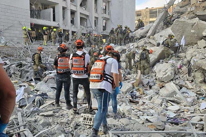 United Hatzalah teams assist at the impact site of an Iranian missile that hit Bat Yam, Israel, on June 15, 2025. Credit: Courtesy of United Hatzalah.