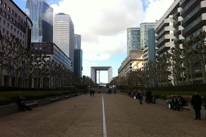 Pedestrians walk through the center of Courbevoie, France, in 2014. Photo by Lucian Duma/Wikimedia Commons.