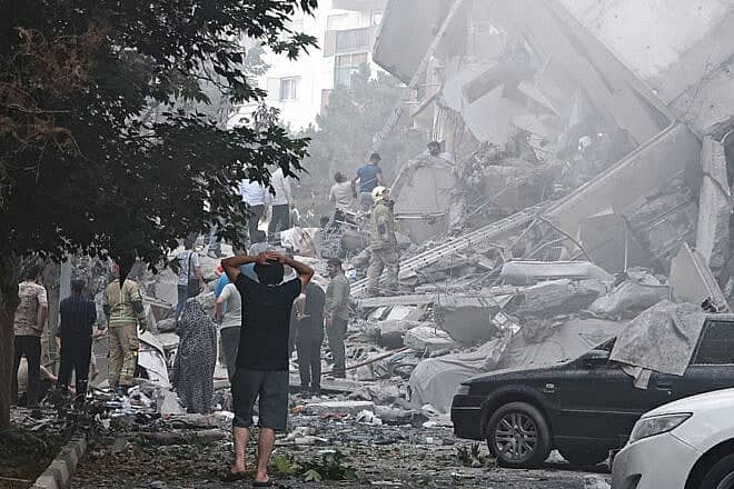 People look over damage to buildings in Nobonyad Square, Tehran, following Israeli airstrikes on June 13, 2025. Photo by Majid Saeedi/Getty Images.