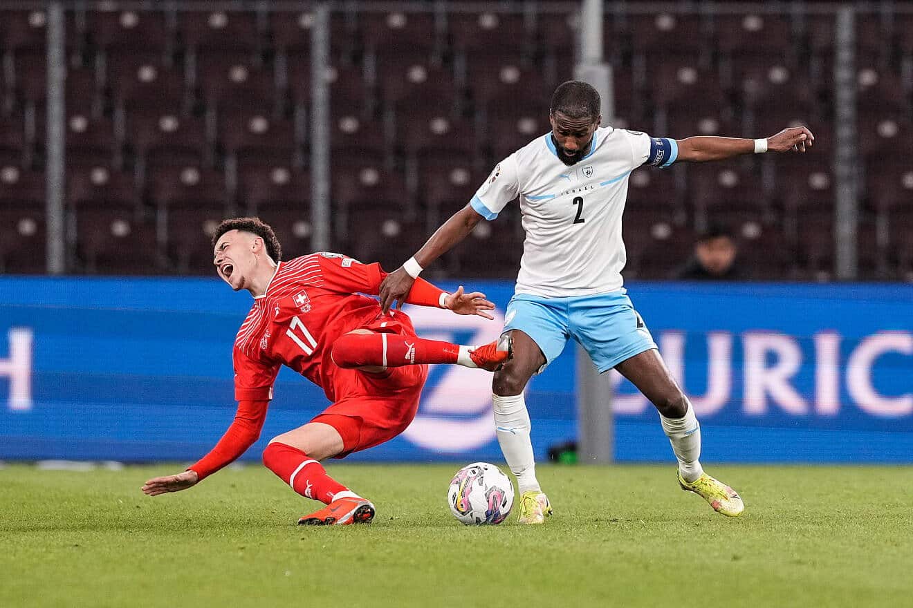 Rubén Vargas of Switzerland (left) against Eli Dasa of Israel during a UEFA EURO 2024 qualifying round group I match at Stade de Genève on March 28, 2023. Photo by Jari Pestelacci/Eurasia Sport Images via Getty Images.