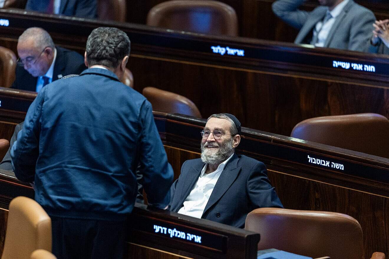 Defense Minister Israel Katz speaks with United Torah Judaism Knesset member Moshe Gafni during a vote on the proposal to dissolve parliament, June 12, 2025. Photo by Chaim Goldberg/Flash90.