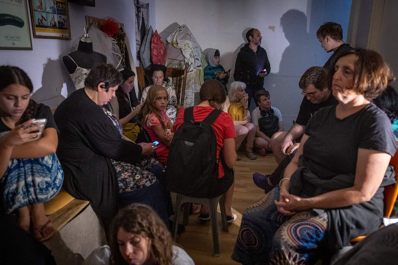 Israelis take cover in a public shelter in Jerusalem during a ballistic missile attack fired from Iran on June 15, 2025. Photo by Noam Revkin Fenton/Flash90.