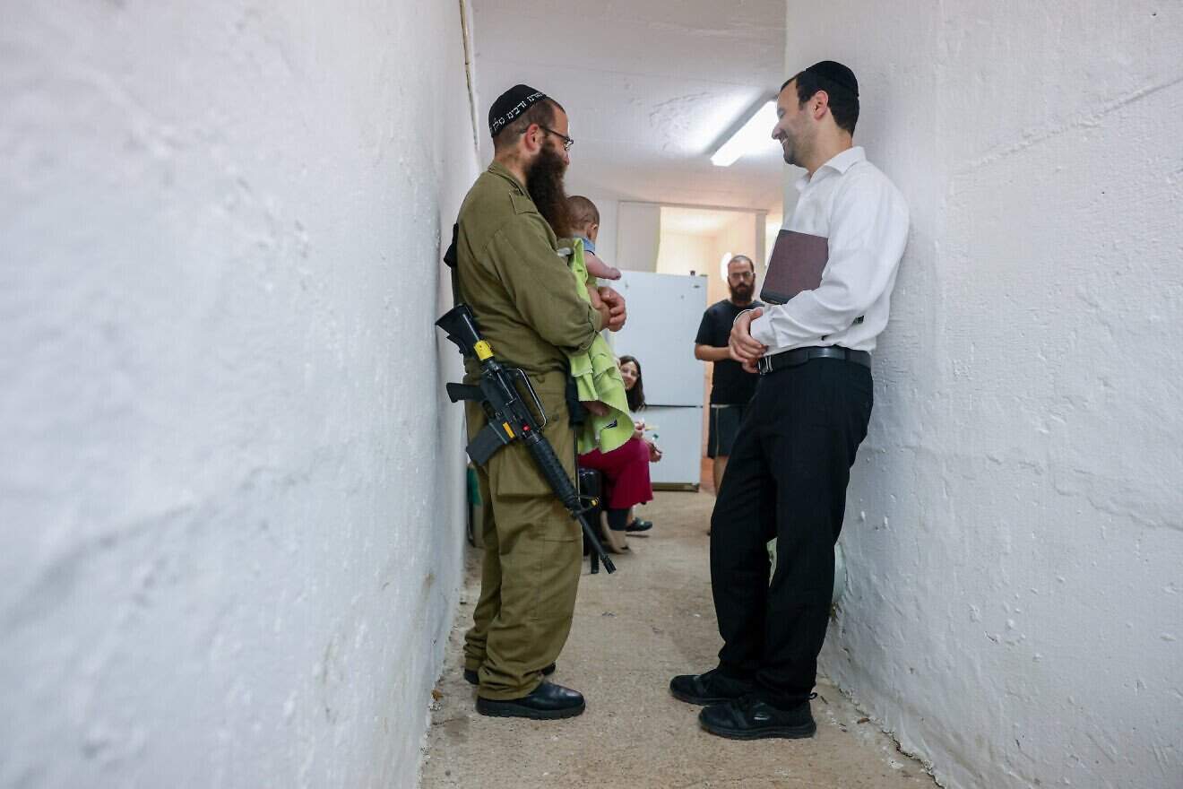 Ultra-Orthodox Jews pray inside a public shelter in northern Israel during alarms and rocket and missile fire from Iran into Israel. June 16, 2025. Photo by David Cohen/FLASH90. Ultra-Orthodox Jews pray inside a public shelter in northern Israel during alarms and rocket and missile fire from Iran into Israel. June 16, 2025. Photo by David Cohen/FLASH90.