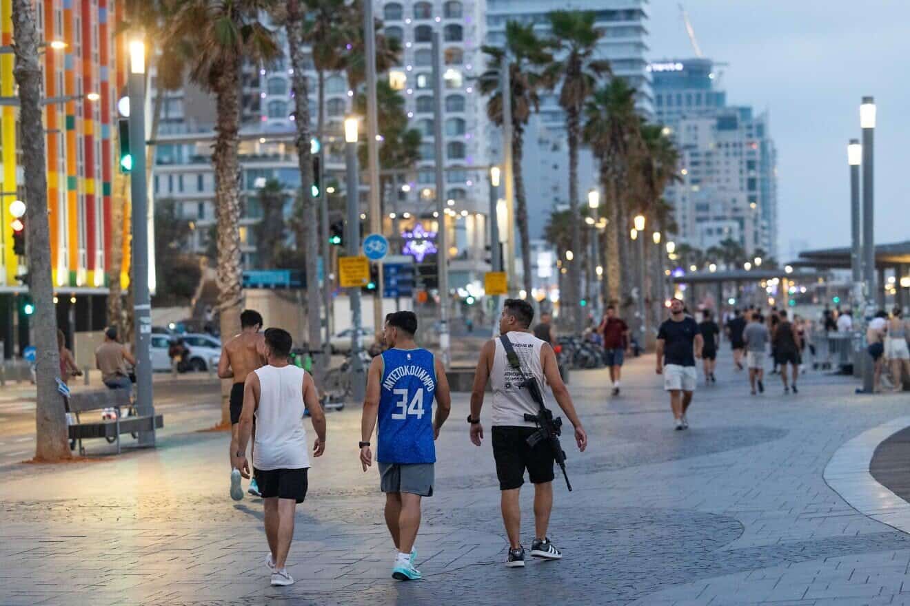 Israels enjoy at the beach promenade in Tel Aviv, June 17, 2025. Photo by Chaim Goldberg/Flash90.