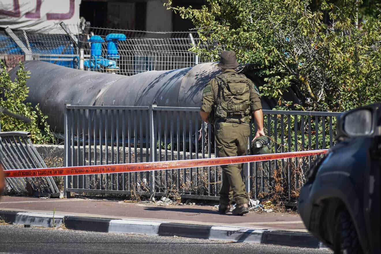 An Israeli soldier at the scene where part of a ballistic missile fired from Iran fell outside a major city in Samaria, June 19, 2025. Photo by Hoshenya Yarden/Flash90.