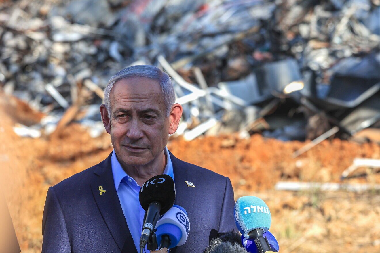 Israeli Prime Minister Benjamin Netanyahu visits the scene where a ballistic missile fired from Iran hit and caused damage at the Weizmann Institute in Rehovot, June 20, 2025. Credit: Itai Ron/POOL.