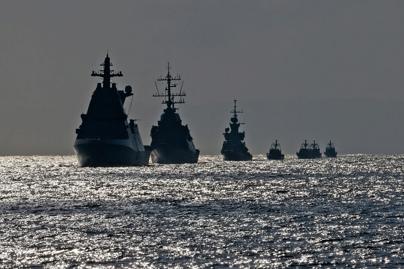 A flotilla of Israeli navy ships sails during a welcome ceremony for the Atzmaut warship, a Saar 6 corvette, after its arrival from Germany, on Aug. 10, 2021, in the Mediterranean Sea, some 40 kilometers off the Israeli coast. Photo by Menahem Kahana/AFP via Getty Images.