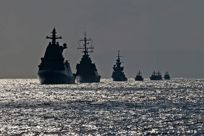 A flotilla of Israeli navy ships sails during a welcome ceremony for the Atzmaut warship, a Saar 6 corvette, after its arrival from Germany, on Aug. 10, 2021, in the Mediterranean Sea, some 40 kilometers off the Israeli coast. Photo by Menahem Kahana/AFP via Getty Images.