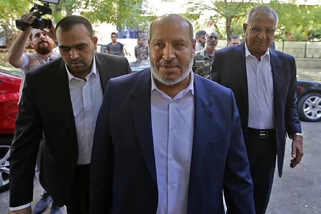 Hamas's chief representative in Lebanon Osama Hamdan (left), Hamas Arab relations chief Khalil al-Hayya (center), and secretary general of the Popular Front for the Liberation of Palestine-General Command, Talal Naji, arrive for a press conference during a visit to the Syrian capital Damascus, on Oct. 19, 2022. Photo by Louai Beshara/AFP via Getty Images.