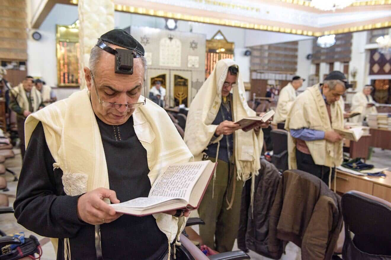 Iranian Jewish men pray in a synagogue in Tehran, Feb. 13, 2020. Photo by Hossein Beris/Middle East Images/AFP via Getty Images.