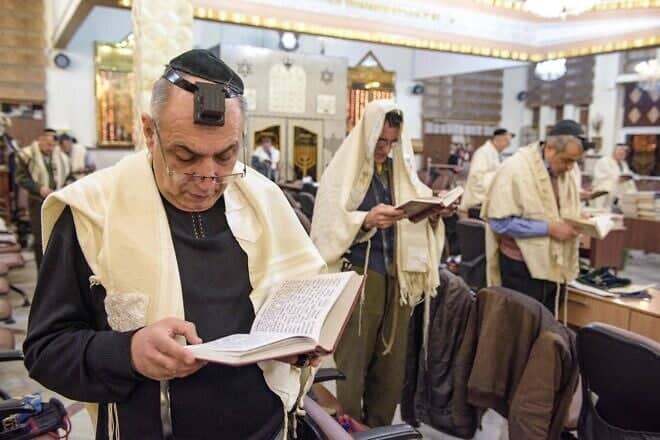 Iranian Jewish men pray in a synagogue in Tehran, Feb. 13, 2020. Photo by Hossein Beris/Middle East Images/AFP via Getty Images.