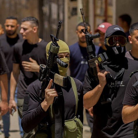 Civilians and terrorists attend the funeral of two Palestinians—aged 17 and 24—killed in an Israeli airstrike at the Balata camp in Nablus, Samaria, on July 28, 2024. Photo by Wahaj Bani Moufleh/Middle East Images/AFP via Getty Images.