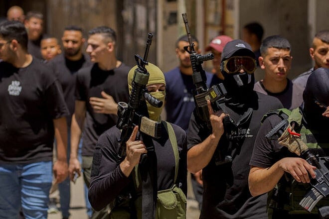 Civilians and terrorists attend the funeral of two Palestinians—aged 17 and 24—killed in an Israeli airstrike at the Balata camp in Nablus, Samaria, on July 28, 2024. Photo by Wahaj Bani Moufleh/Middle East Images/AFP via Getty Images.