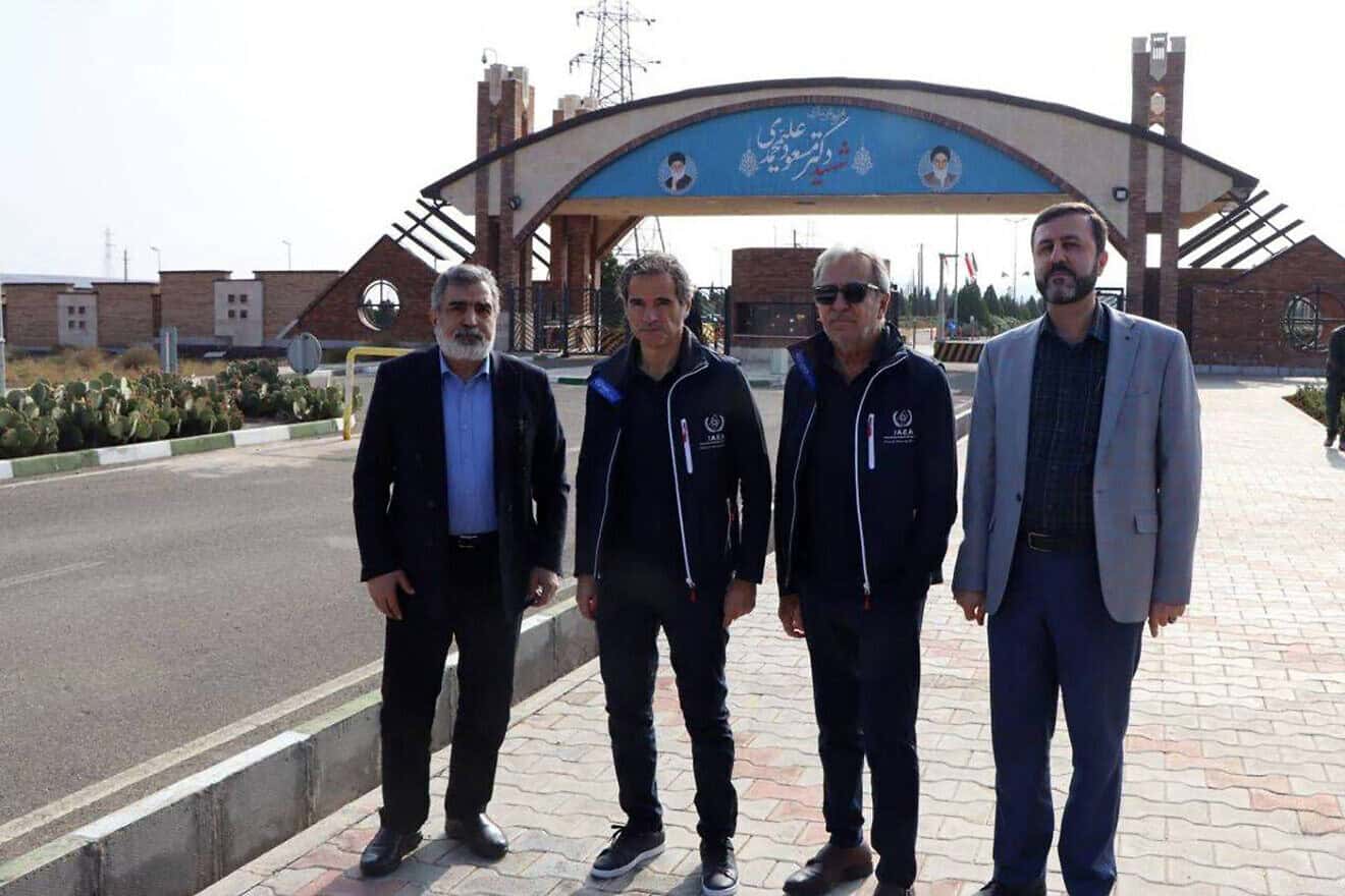 Behrouz Kamalvandi, spokesman of the Atomic Energy Organization of Iran, (left), Rafael Grossi, chief of the International Atomic Energy Agency, (second from left) and Iranian Deputy Foreign Minister Kazem Gharib Abadi (far right) in front of the gate of the Fordow nuclear enrichment plant near Qom, on Nov. 15, 2024. Photo by Atomic Energy Organization of Iran/AFP via Getty Images.