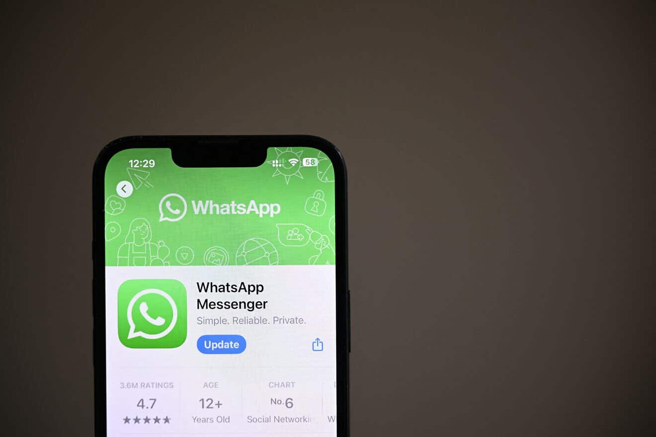An illustrative photo shows the WhatsApp messaging and video app in the App Store displayed on a phone screen, in a residential property in Guildford, south of London, on April 17, 2025. Photo by Justin Tallis/AFP via Getty Images.