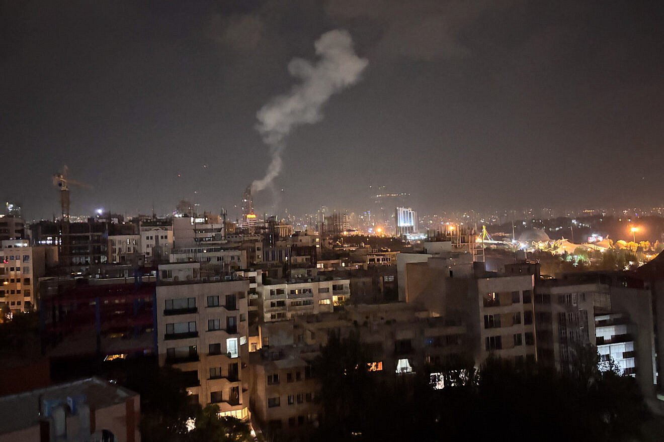 Smoke rises from a location allegedly targeted in Israel's wave of strikes on Tehran, Iran, early on the morning of June 13, 2025. Credit: SAN/Middle East Images/AFP via Getty Images.