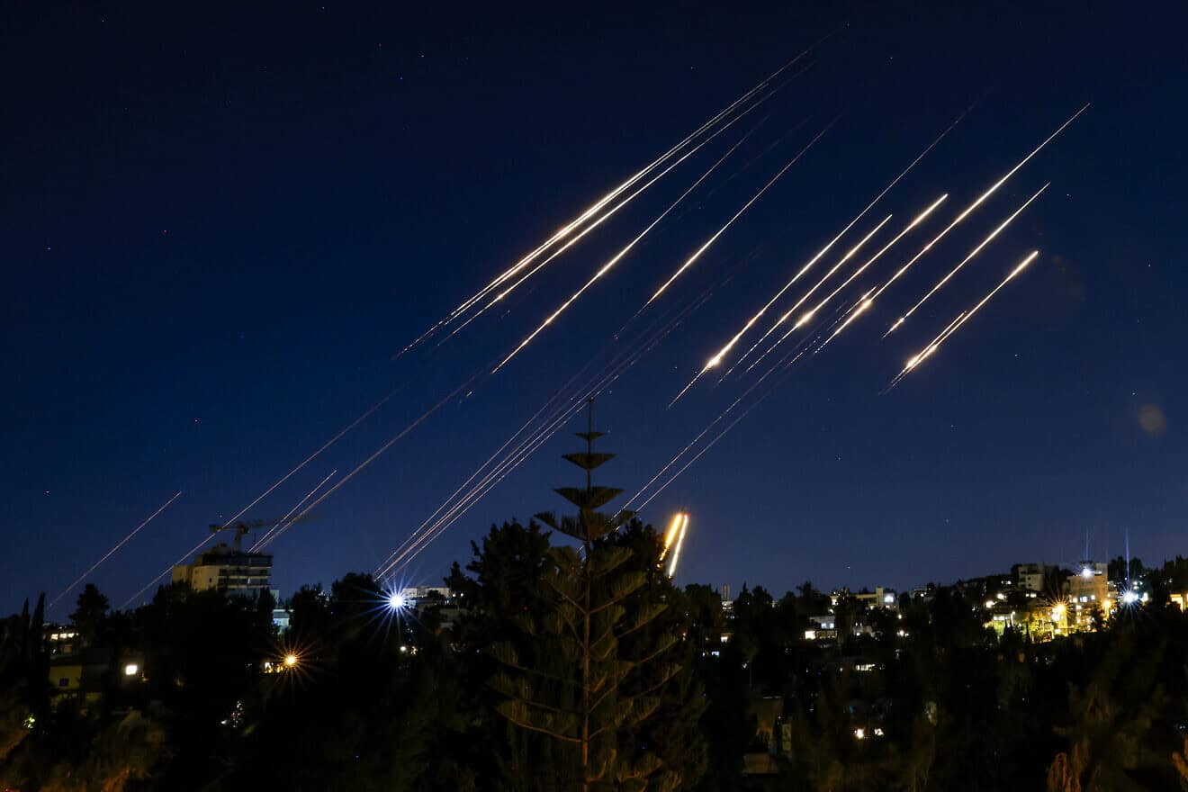 Missiles fired from Iran are pictured in the night sky over Jerusalem on June 14, 2025. Photo by Menahem Kahana/AFP via Getty Images)