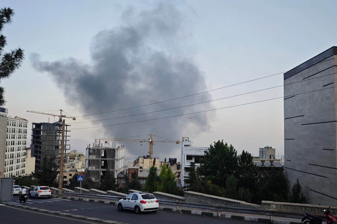 Smoke rises after an Israeli strike on the headquarters of the Islamic Republic of Iran Broadcasting propaganda channel in Tehran, June 16, 2025. Photo by Stringer/Getty Images.