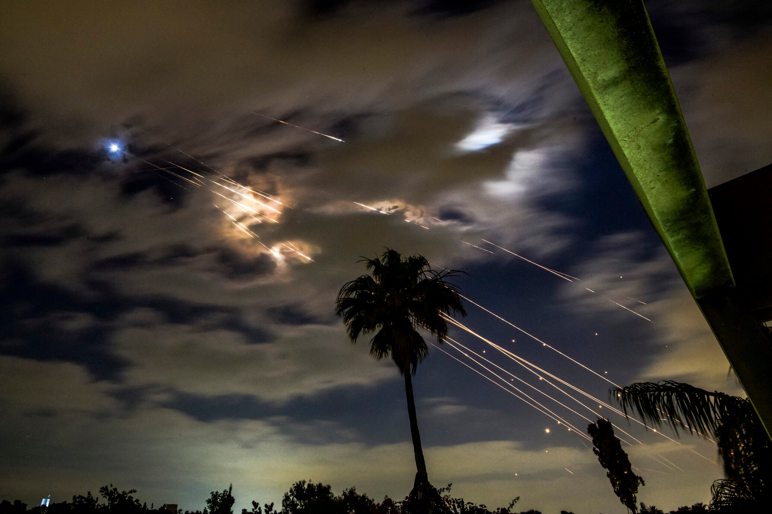 Israel's air defense targets Iranian missiles in the sky of Tel Aviv, June 16, 2025. Photo by Matan Golan/Middle East Images/AFP via Getty Images.